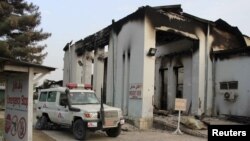 Afghanistan -- A vehicle is parked in front of a damaged building at Medecins Sans Frontieres (MSF) in Kunduz, Afghanistan October 16, 2015. 