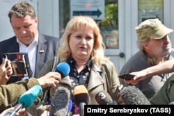 Lawyer Olga Mikhailova told journalists outside the hospital that she believes Navalny was poisoned.