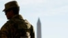 A member of the Louisiana National Guard patrols at the Lincoln Memorial on November 27, a day after two National Guard members were shot in Washington, D.C.