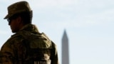A member of the Louisiana National Guard patrols at the Lincoln Memorial on November 27, a day after two National Guard members were shot in Washington, D.C.