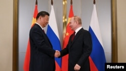 Ресей президенті Владимир Путин және Қытай басшысы Си Цзиньпин. 2024 жыл. 
