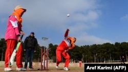 Afghan women play cricket at the grounds of the stadium in the western city of Herat in 2015.