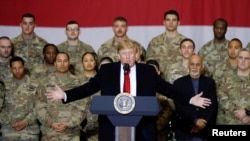U.S. President Donald Trump delivers remarks to U.S. troops during an unannounced visit to Bagram Air Base near Kabul on November 28, 2019.