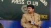 FILE: Hamid Mir recoded his television show outside the Islamabad Press Club to protest a ban by military dictator Pervez Musharraf in 2007.