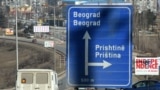 Kosovo - A board reading "Independence" is seen behind a road sign the entrance of Pristina on February 15, 2008.