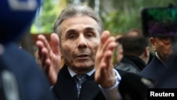 The founder of the Georgian Dream party, Bidzina Ivanishvili, leaves a polling station after casting his vote in parliamentary elections in Tbilisi in October 2024.