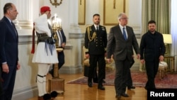 Ukrainian President Volodymyr Zelenskyy meets with Greek President Constantine Tassoulas at the presidential palace in Athens on November 16.