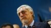 Afghan presidential candidate Abdullah Abdullah talks with journalists during a press conference in Kabul, on September 30.
