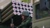 Ukraine - An army soldier of the Donetsk People's Republic (DPR) sitting on a Grad multiple rocket launcher during a Victory Day parade rehearsal in Artyom Street, May 5, 2015