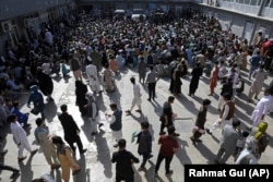 A passport office in Kabul inundated with applicants on June 30.