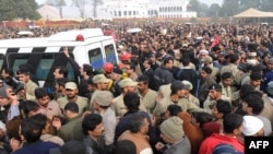 Supporters and activists of the ruling Pakistan People's Party (PPP) follow the funeral procession of assassinated Punjab Governor Salman Taseer in Lahore on January 5.