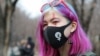 KAZAKHSTAN -- A demonstrator takes part in a march to mark International Women's Day in Almaty, March 8, 2021
