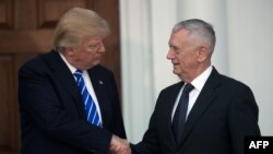 U.S. President-elect Donald Trump shaking hands with retired United States Marine Corps General James Mattis after their meeting at Trump International Golf Club, in Bedminster, New Jersey on November 19.