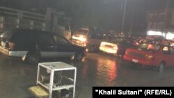 آرشیف/ جاری شدن آب باران به روی سرک ها این تصویر از سرک مکروریان اول شهر کابل است