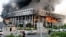 A building of Iranian state broadcaster IRIB in flames after an Israeli air attack in Tehran
