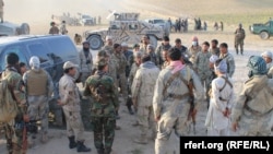 Afghan security forces in the Sanchark district of Sar-e Pul Province (file photo) 