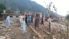 Residents look at the destruction in the aftermath of flash floods in Swat, a district in the northwestern Khyber Pakhtunkhwa Province.