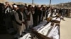 People attend the funeral of victims after a landmine targeted a minibus full of passengers in a Taliban-controlled area of Wardak Province, some 40 kilometers from Kabul, on October 20.