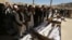People attend the funeral of victims after a landmine targeted a minibus full of passengers in a Taliban-controlled area of Wardak Province, some 40 kilometers from Kabul, on October 20.