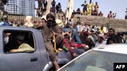 Milițiile Taliban la Jalalabad, în estul Afganistanului, 15 august 2021.