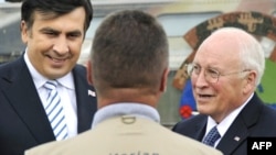 Cheney with Georgia's Mikheil Saakashvili (left) -- future aid will come at a higher price.