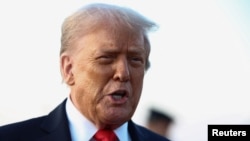 US President Donald Trump speaks to reporters at Joint Base Andrews.