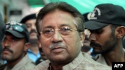 Former Pakistani President Pervez Musharraf is escorted by soldiers as he arrives at a terrorism court in Islamabad in April.
