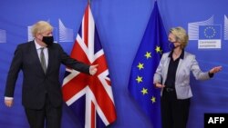 Boris Johnson is welcomed by European Commission President Ursula von der Leyen