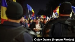 Romania Bucharest anti Covid vaccine and restrictions protest Cotroceni. AUR leader George Simion