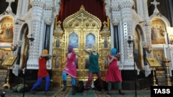 Russia -- Members of Pussy Riot sing a protest song against Vladimir Putin and the support of the Orthodox Church for him in Moscow'as main cathedral.