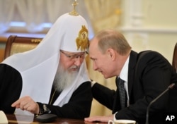 Patriarhul Kiril și Vladimir Putin