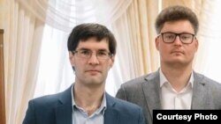 Lawyers Syarhey Zikratski (left) and Dzimtry Laeuski: "Now, just for walking and not shouting anything you can be detained," Laeuski says.