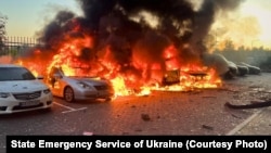Cars burn after a Russian attack on the Kyiv region on September 20. 