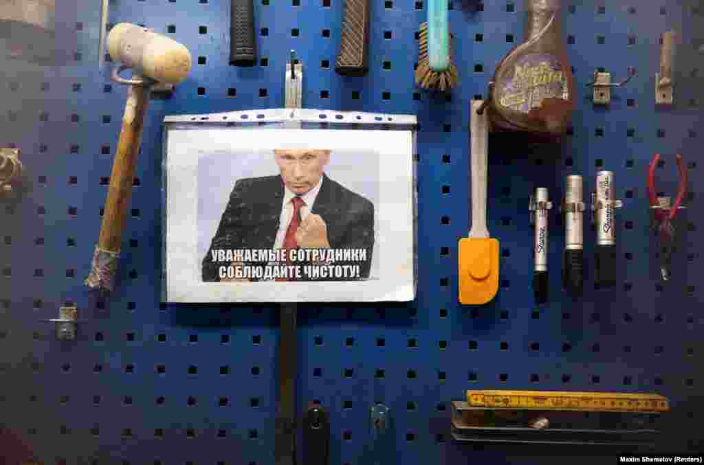 A sign featuring Vladimir Putin saying &ldquo;Dear colleagues, keep clean,&rdquo; in a factory near Murmansk. &nbsp;