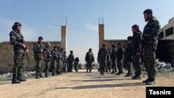 آرشیف، شماری از افغان‌های که توسط ایران در لشکر فاطمیون جذب شده اند در شهر حلب سوریه