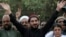 Leader of the Pashtun Tahafuz Movement (PTM) Manzoor Pastheen (C) waves to supporters during a demonstration in Lahore on April 22.