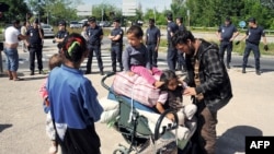 Poliția expulzează romii din tabăra de la Villeurbanne, în apropiere de Lyon, 9 august 2012.