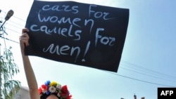 Femen activists protest the ban on women's driving in Saudi Arabia outside that country's embassy