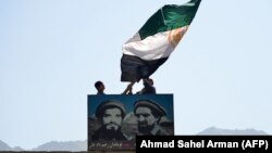 Панжшер өрөөнүнөн чыккан аскер кол башчысы Ахмад Шах Масуддун портрети. Панжшер провинциясы, 23-август, 2021-жыл.