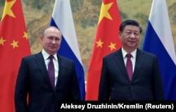 Președintele Rusiei, Vladimir Putin, și cel al Chinei, Xi Jinping, în timpul întâlnirii celor doi lideri de stat de la Beijing de pe 4 februarie 2022.