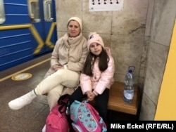 Emilia, a 36-year-old freelance IT-programmer, and her 8-year-old daughter Ira.