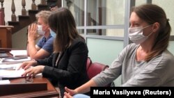 Svetlana Prokopyeva (right) attends a court hearing in Pskov on June 22.