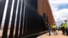 US says entire southern border wall with Mexico to be painted black to deter migrants