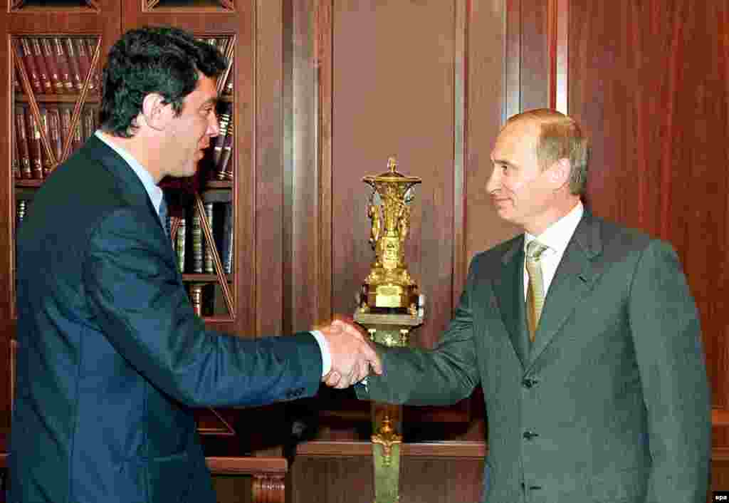 Nemtsov, then a member of the Russian legislature, the State Duma, shakes hands with Russian President Vladimir Putin in the Kremlin in 2000.