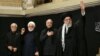 Iran’s Ayatollah Ali Khamenei (right) makes first public appearance since start of Israeli war.