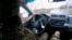 UKRAINE - NEAR POKROVSK - UKRAINIAN SOLDIER DRIVING A CAR - NOVEMBER 2025