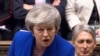  Theresa May vorbind în Parlamentul de la Londra