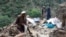 Afghans search remnants of damaged houses, after earthquakes at Nurgal district in Kunar province, in Eastern Afghanistan, on September 4, 2025.