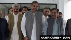 FILE: Pakistani Prime Minister Shahid Khaqan Abbasi (C) with his party leaders in Islamabad on August 1, 2017.