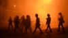 Riot police disperse protesters in Yerevan's Sari Tagh neighborhood late on July 29.